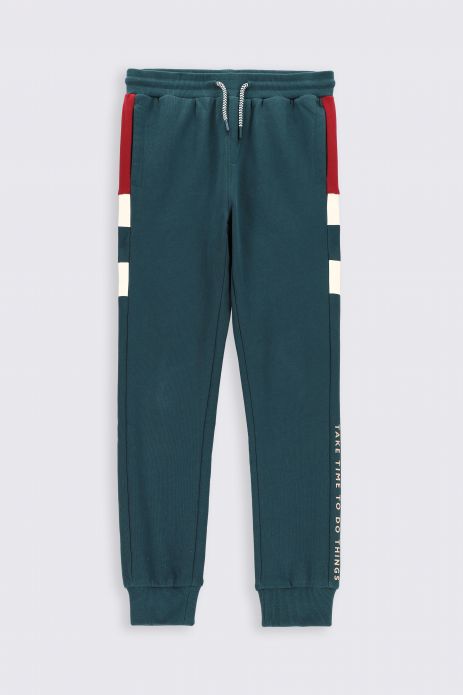 Sweatpants green with pockets and other material inserts in regular cut 